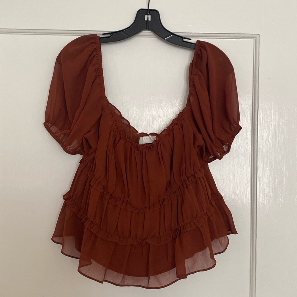 Astr the label burnt orange/copper top